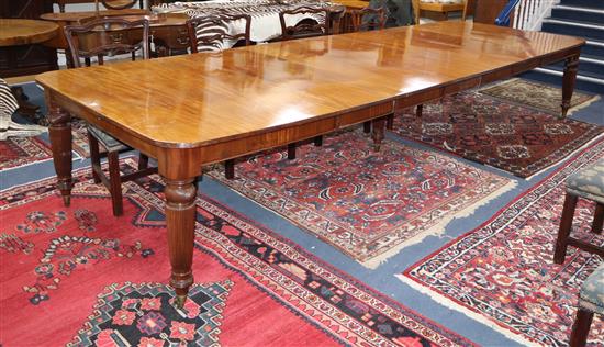 A late Victorian mahogany extending dining table on fine fluted tapered legs. 400cm extended